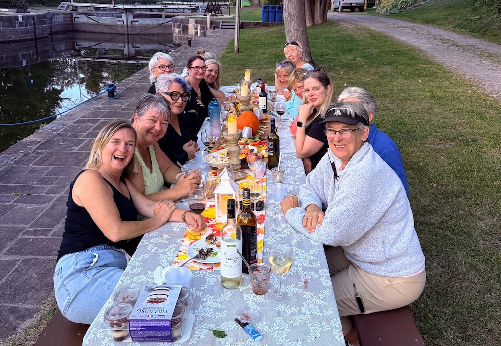 Friends sharing a meal and conversation on a women’s escape